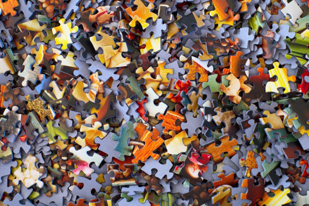 Pile of puzzle pieces in various colors
